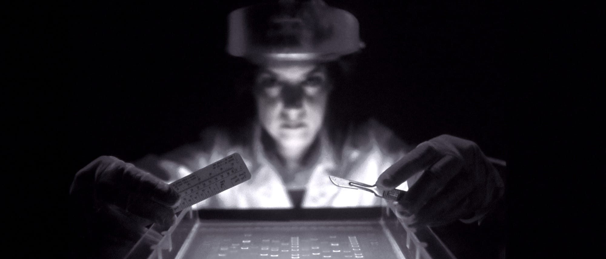 woman doing research while holding equipment